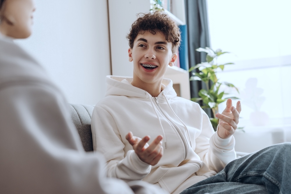 Smiling teen during teen mental health treatment