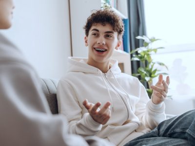Smiling teen during teen mental health treatment
